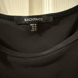 Hairstylist pro wear BLACKPANTS tank. Bleach and hair resistant